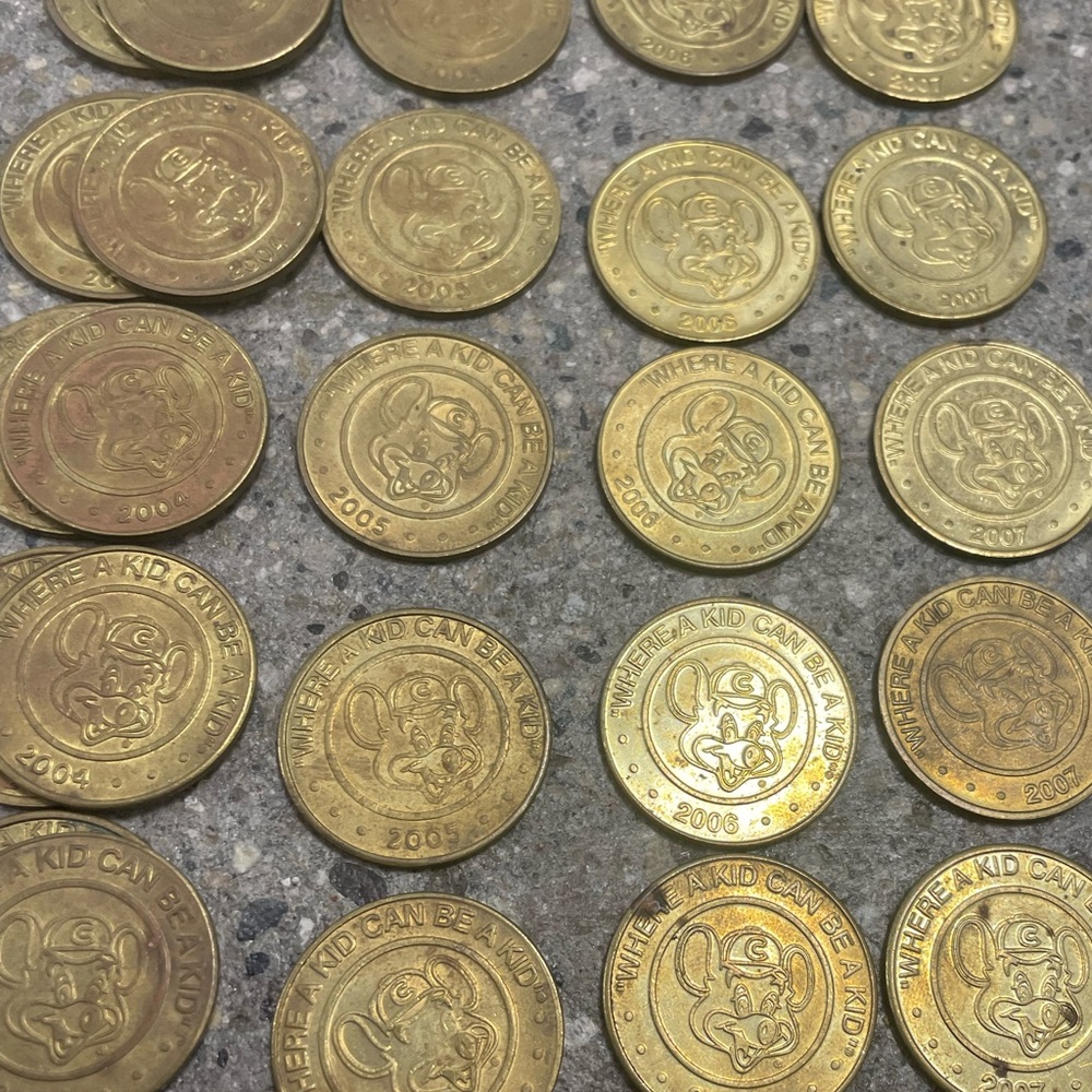 Lot of 57 Vintage 1999-2010 Chuck E Cheese arcade game collectible golden tokens